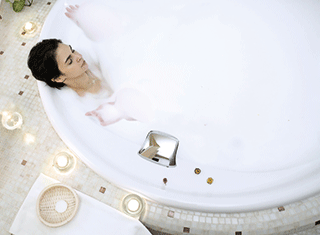 A photo of a woman in a bath